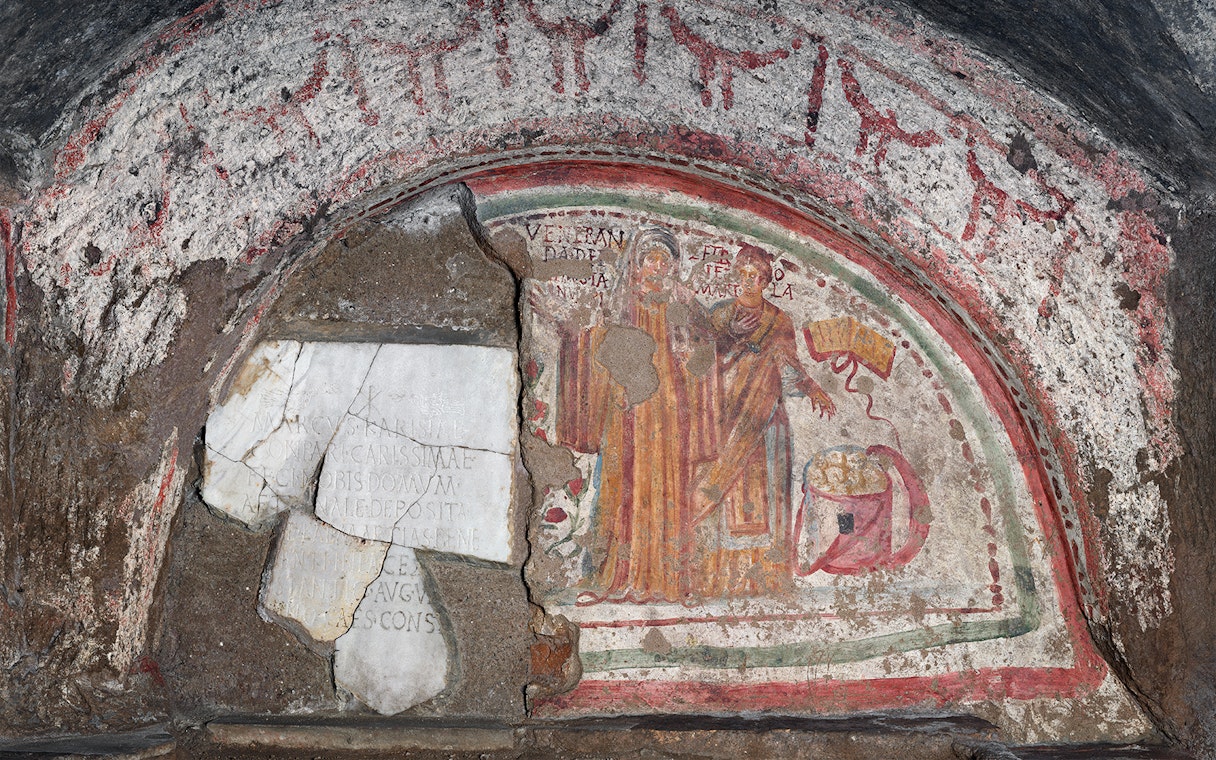 Fresco of The Martyrs in the Catacombs of Domitilla, Rome, depicting two figures with inscriptions.