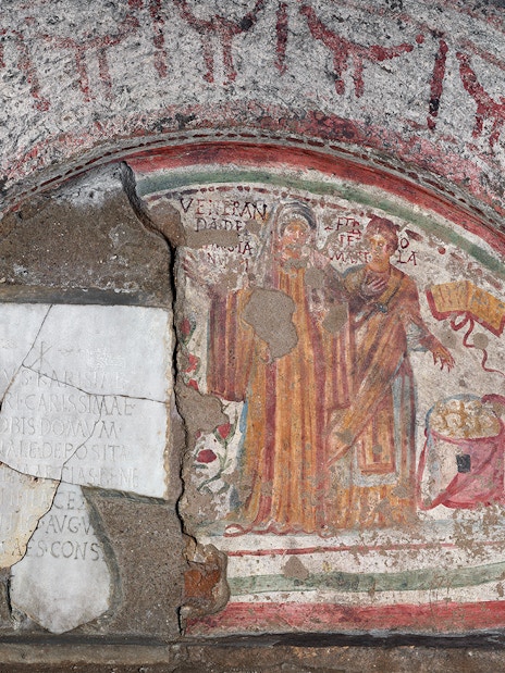Fresco of The Martyrs in the Catacombs of Domitilla, Rome, depicting two figures with inscriptions.