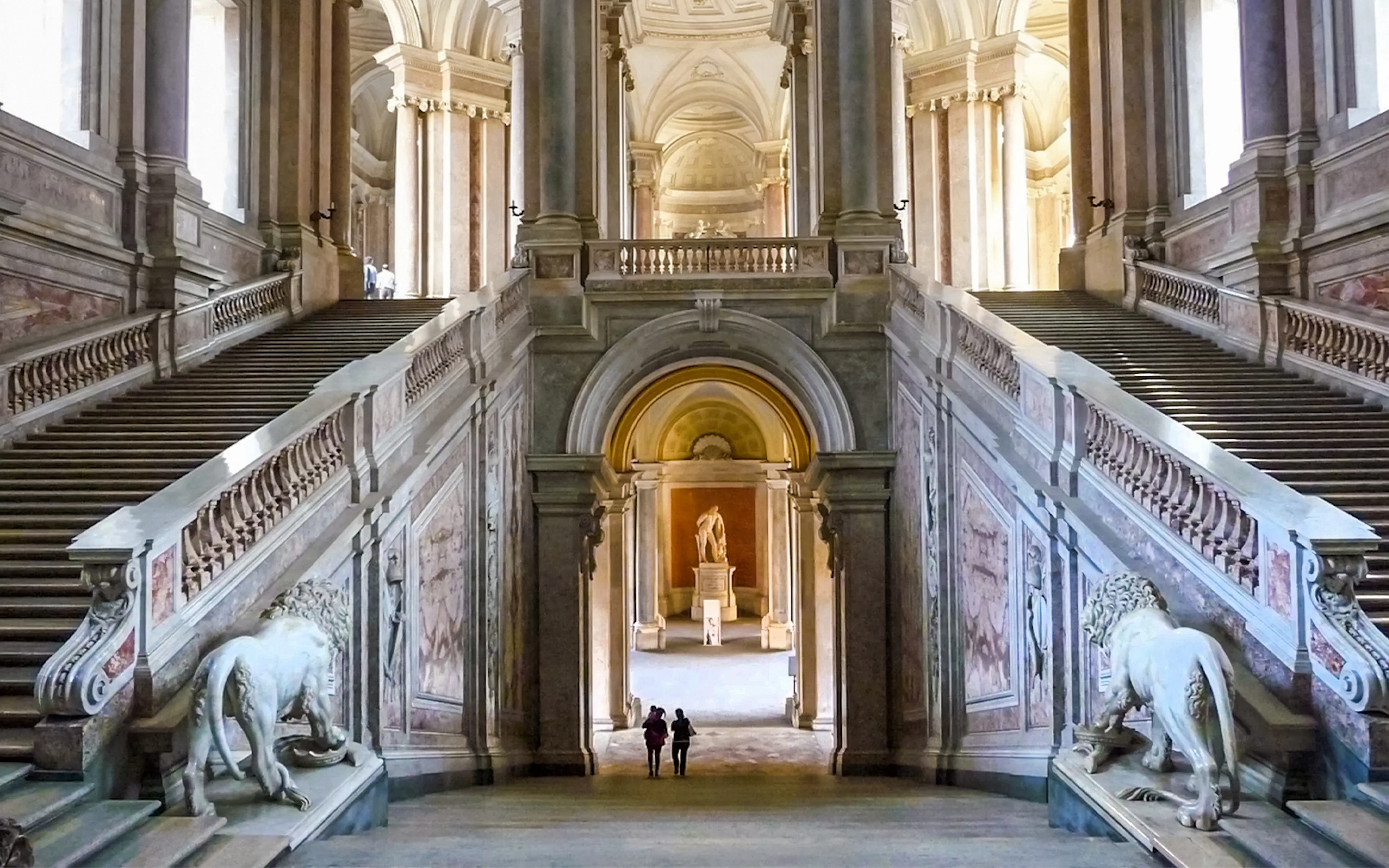 Grand staircase with lion sculptures at Royal Palace of Caserta, Italy.