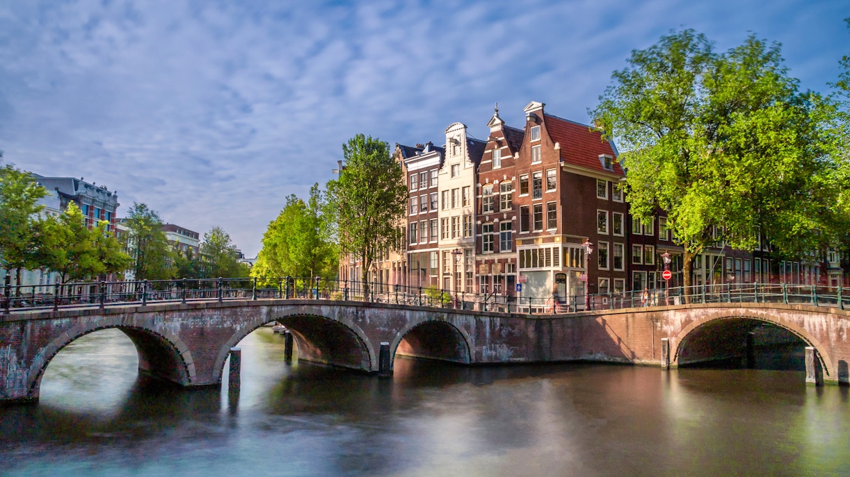 Keizersgracht and Leidsegracht canal intersection with historic buildings in Amsterdam, Netherlands.