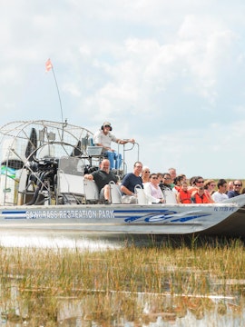 Airboat tour at Sawgrass Recreation Park, Florida, with passengers exploring the Everglades.