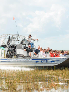 Airboat tour at Sawgrass Recreation Park, Florida, with passengers exploring the Everglades.
