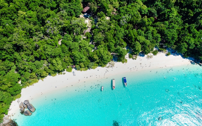 Aerial view of Island No. 4, Similan Islands, featuring white sandy beach and turquoise water.