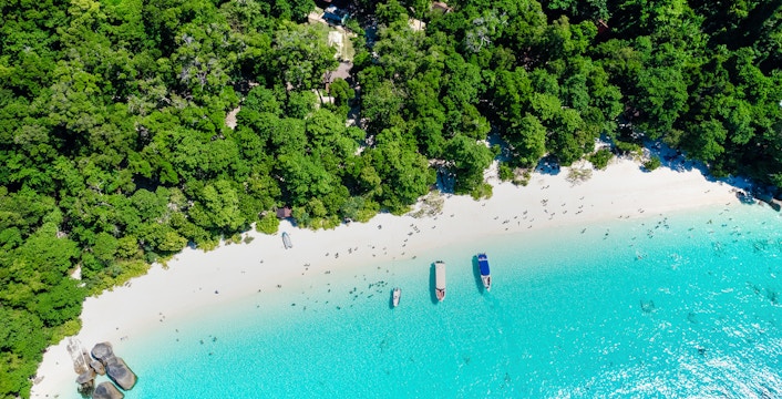 Aerial view of Island No. 4, Similan Islands, featuring white sandy beach and turquoise water.