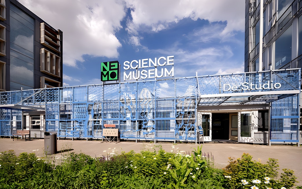 NEMO Science Museum De Studio entrance with blue facade in Amsterdam.