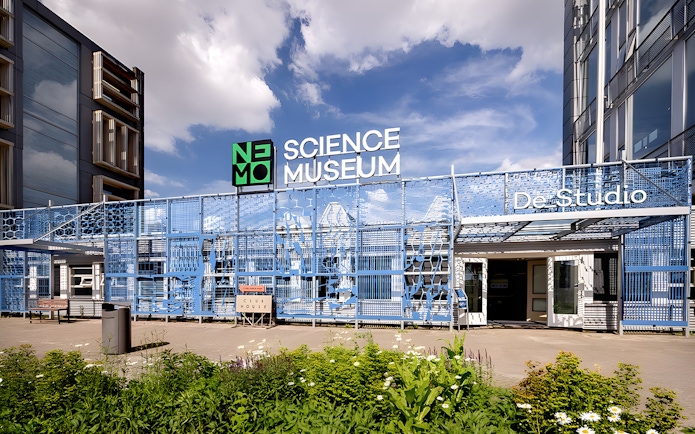 NEMO Science Museum De Studio entrance with blue facade in Amsterdam.