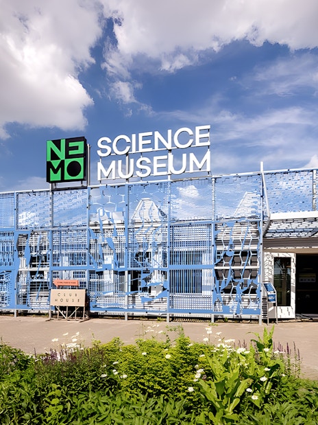 NEMO Science Museum De Studio entrance with blue facade in Amsterdam.