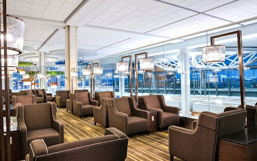 Plaza Premium Lounge seating area at Vancouver International Airport's domestic departures.