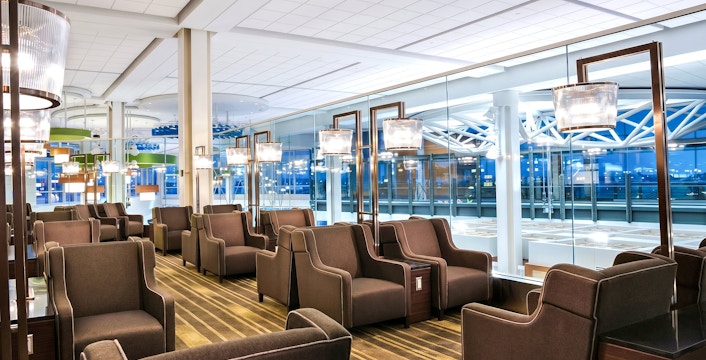 Plaza Premium Lounge seating area at Vancouver International Airport's domestic departures.
