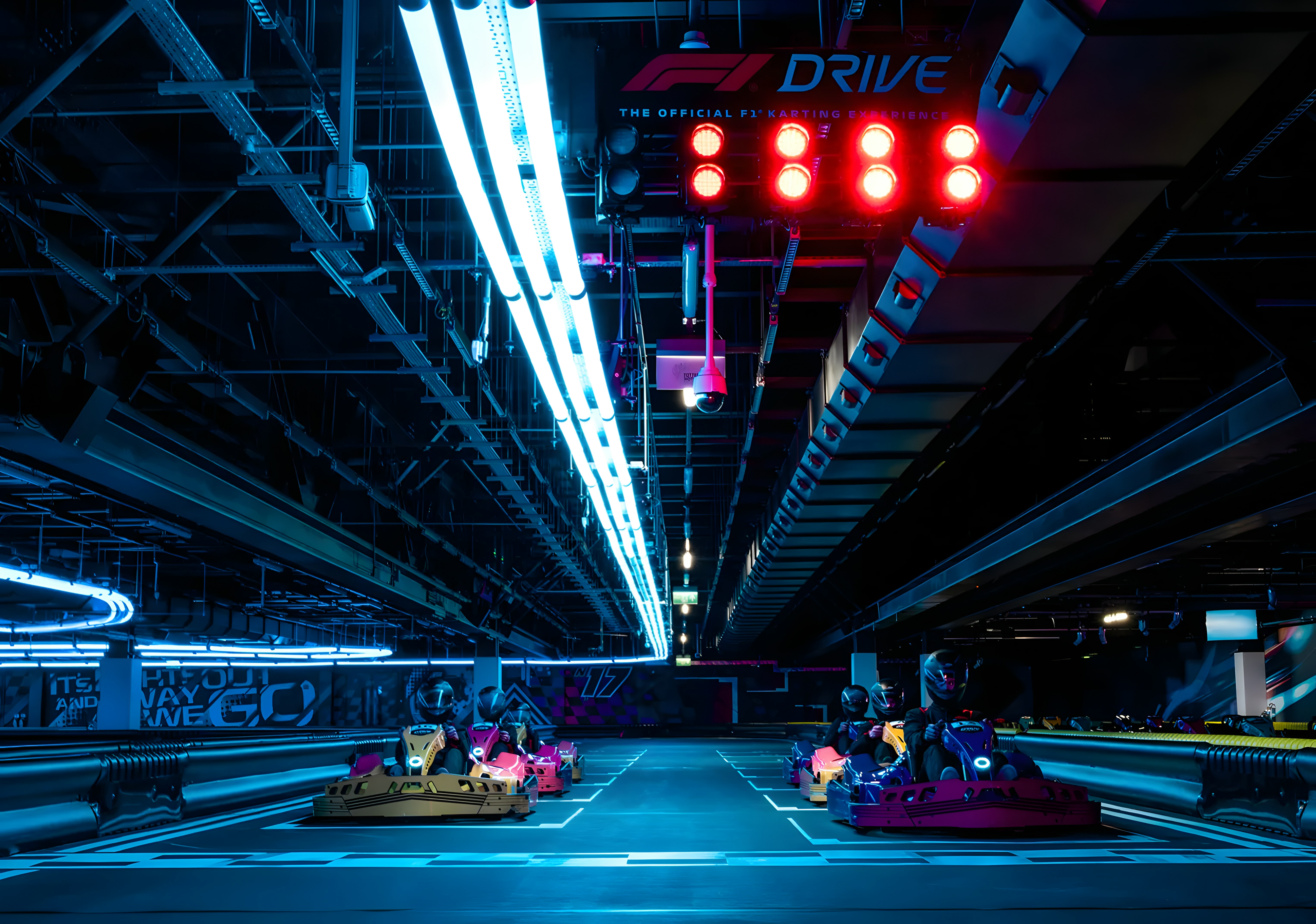 Guests driving go-karts at the F1 Drive experience in London.