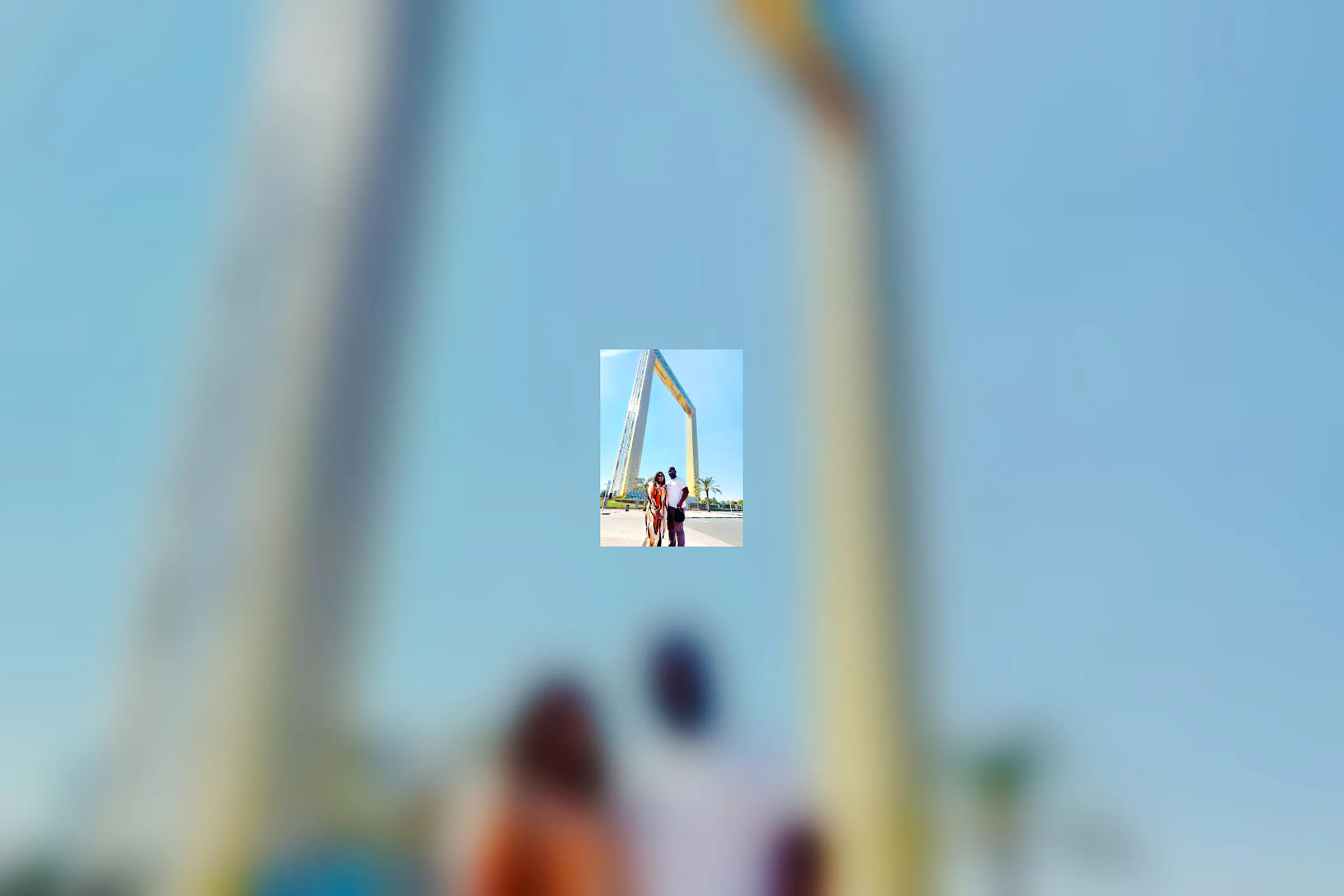 Dubai Frame with visitors in foreground during city sightseeing tour.