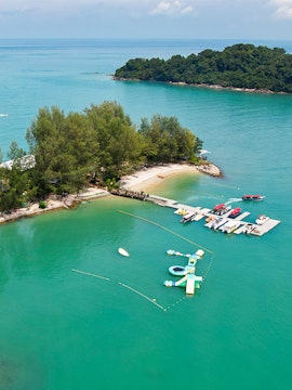 Langkawi Island Hopping tour with boats docked at a small island pier.