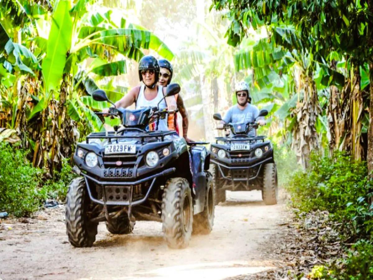 Quad biking through lush banana trails in Zanzibar.
