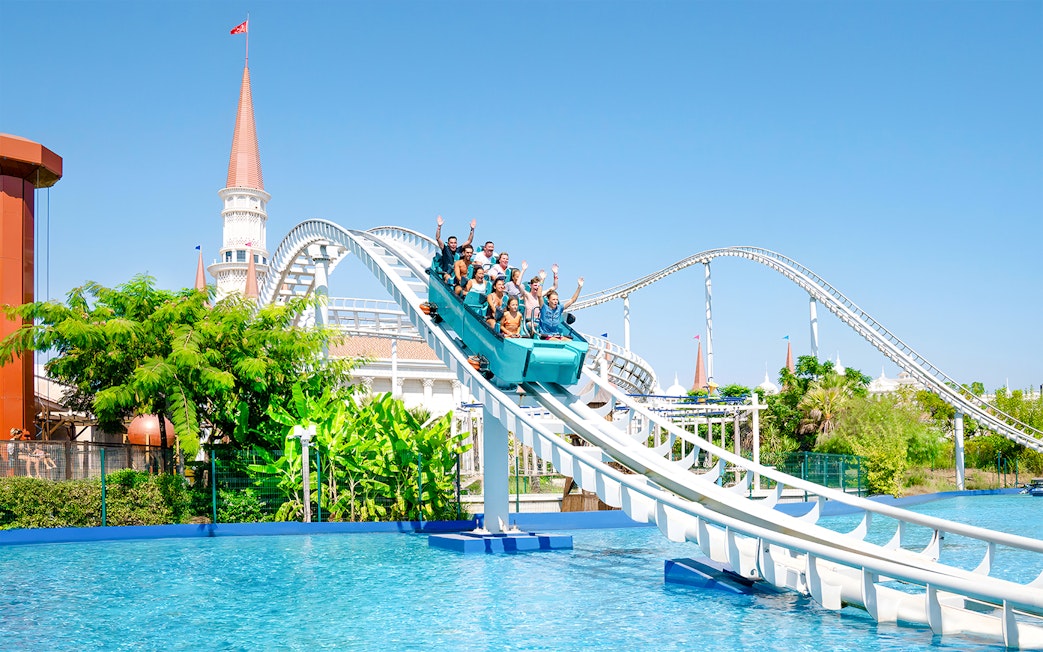 Roller coaster descending into water at Land of Legends Themepark, Turkey.