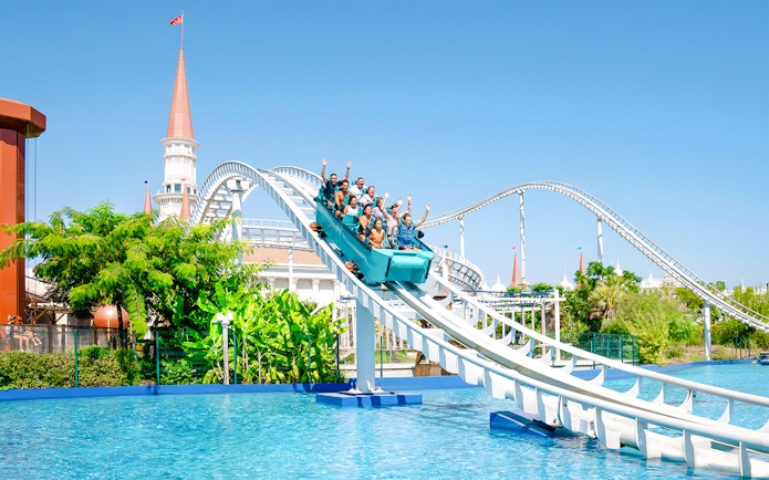 Roller coaster descending into water at Land of Legends Themepark, Turkey.