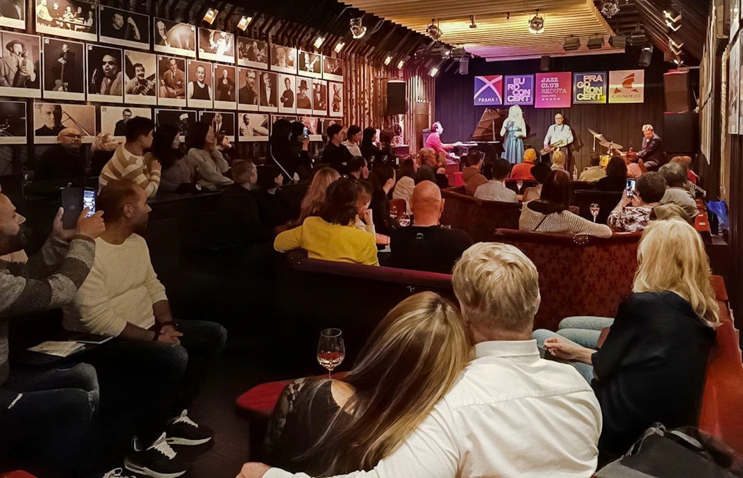 Audience enjoying live music at Reduta Jazz Club concert in Prague.