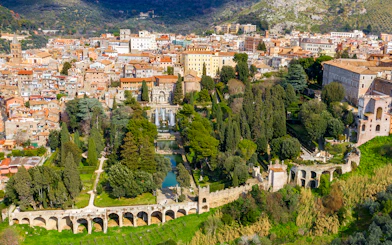 Tourists exploring Villa d'Este gardens in Tivoli, Italy with skip-the-line tickets.