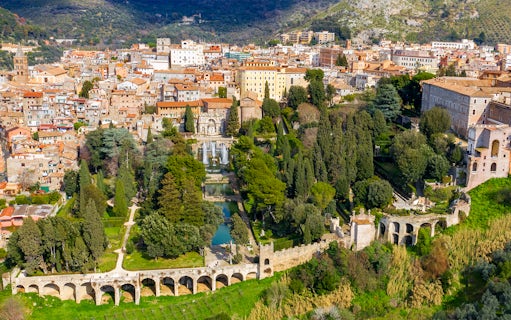 Tourists exploring Villa d'Este gardens in Tivoli, Italy with skip-the-line tickets.