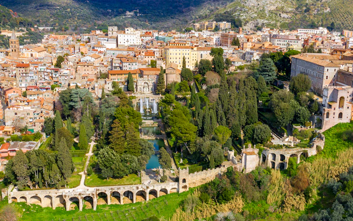 Tourists exploring Villa d'Este gardens in Tivoli, Italy with skip-the-line tickets.