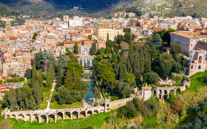 Tourists exploring Villa d'Este gardens in Tivoli, Italy with skip-the-line tickets.
