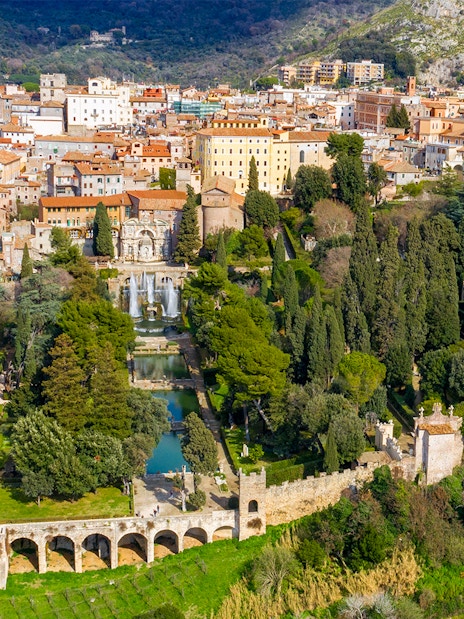 Tourists exploring Villa d'Este gardens in Tivoli, Italy with skip-the-line tickets.