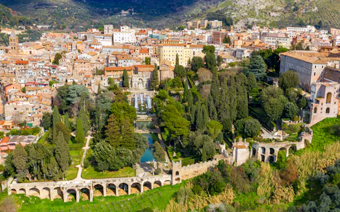 Tourists exploring Villa d'Este gardens in Tivoli, Italy with skip-the-line tickets.