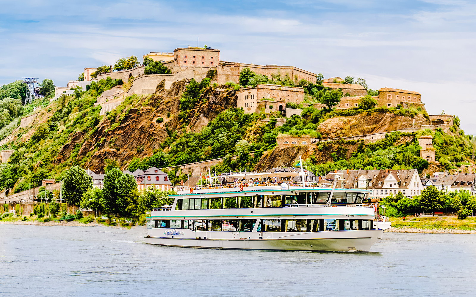 Gilles Boat cruising on the Rhine River with Ehrenbreitstein Fortress in the background.