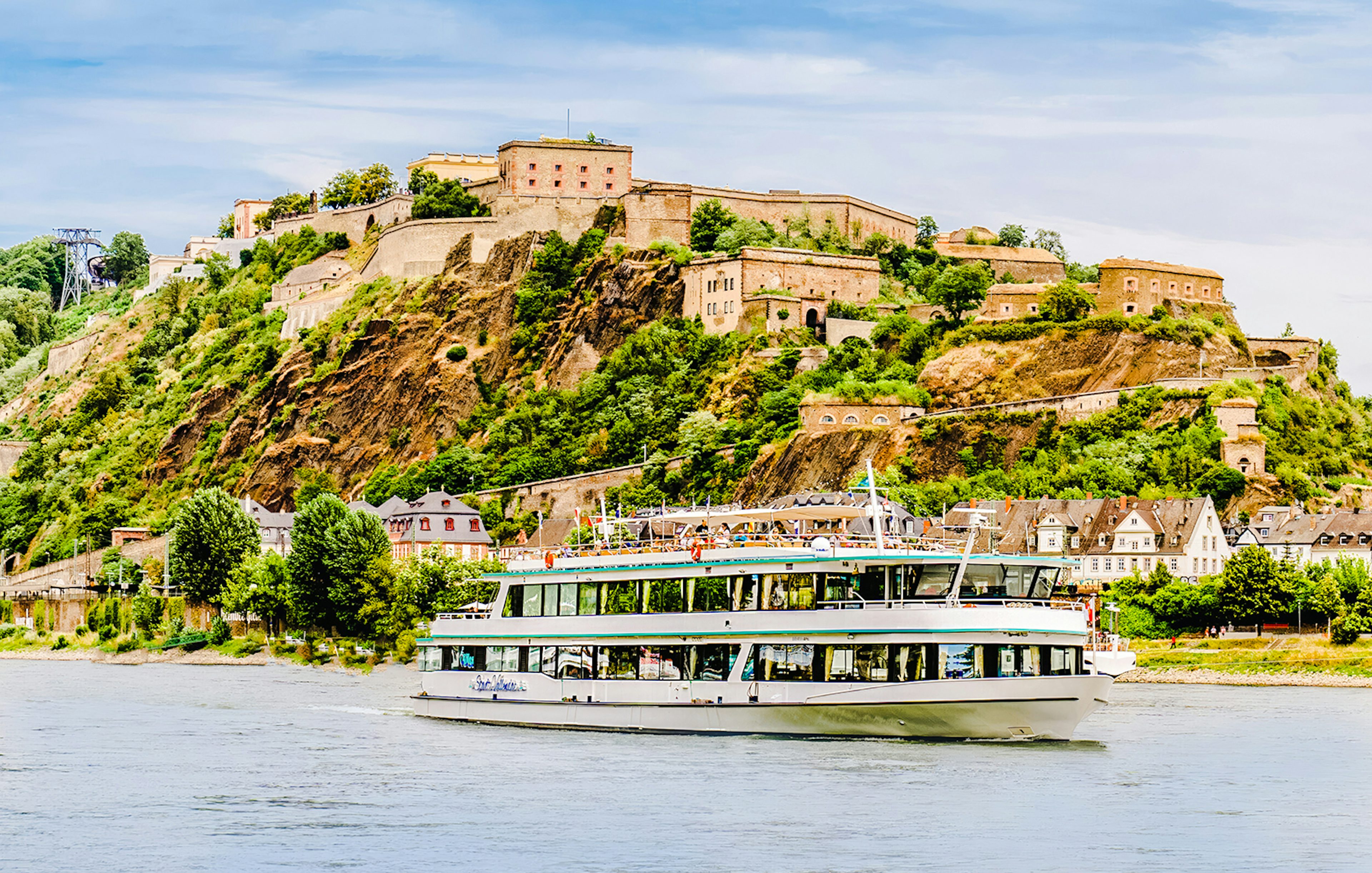 Gilles Boat cruising on the Rhine River with Ehrenbreitstein Fortress in the background.