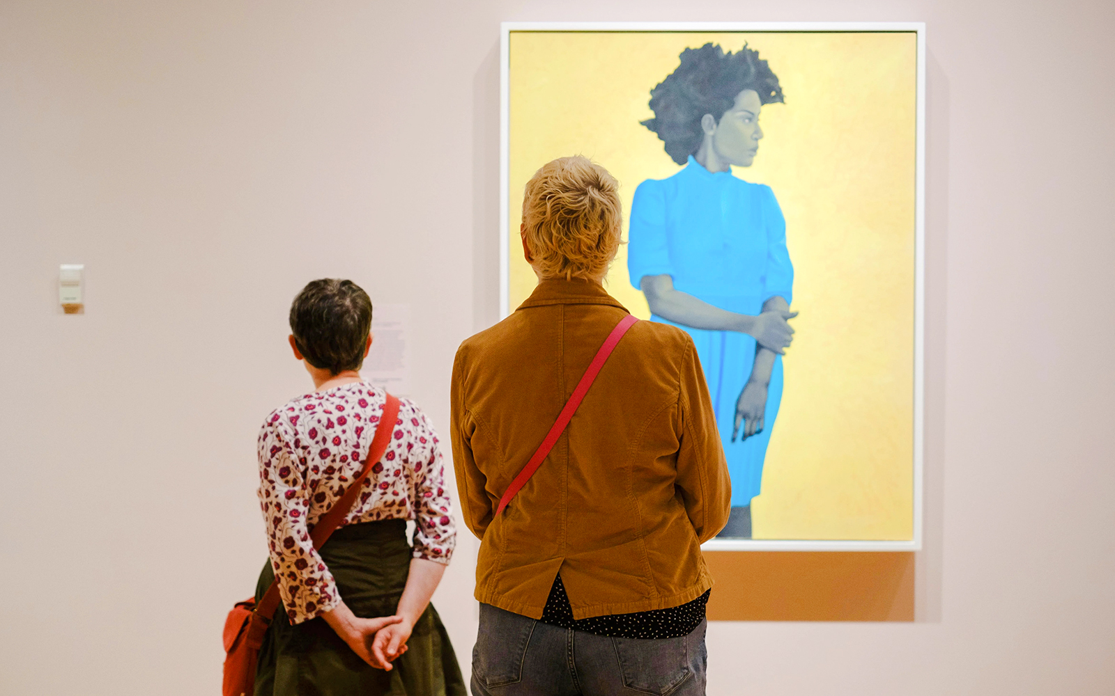 Visitors viewing artwork at Seattle Art Museum exhibition.