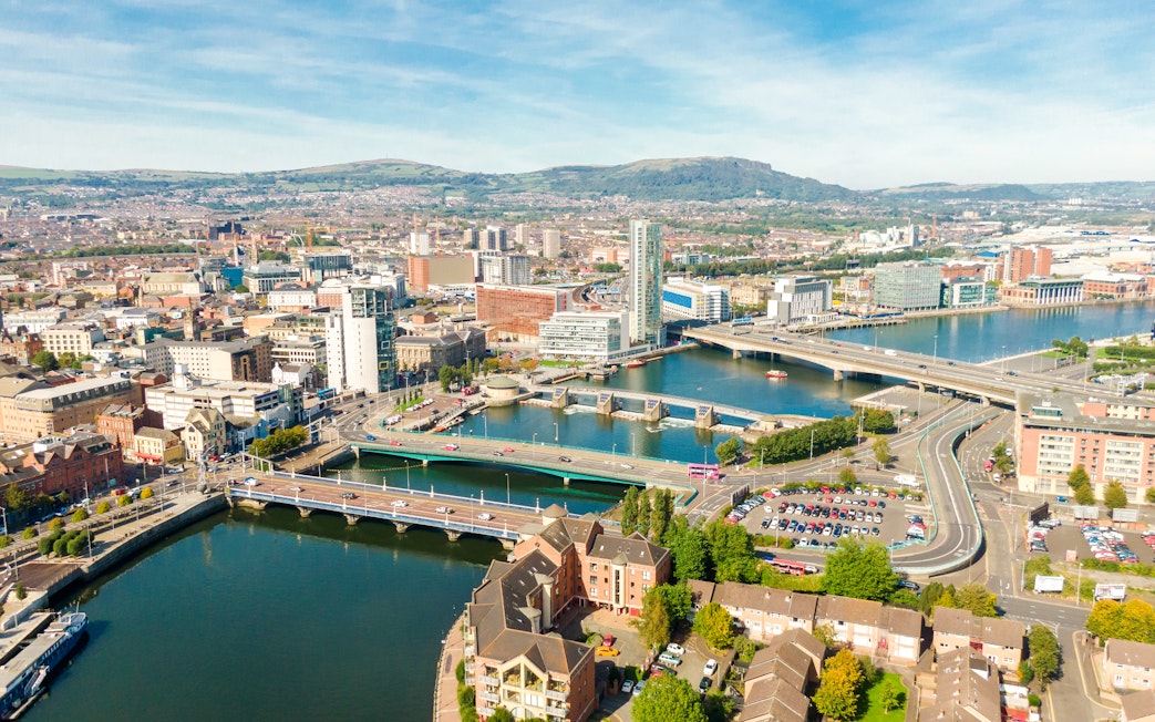 Aerial view of Belfast cityscape with bridges over the River Lagan.