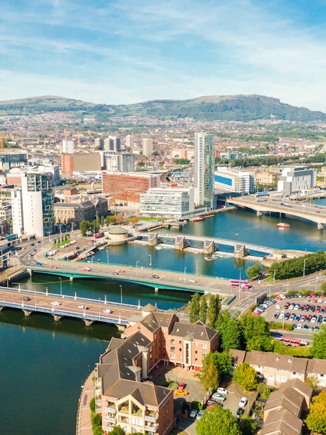Aerial view of Belfast cityscape with bridges over the River Lagan.