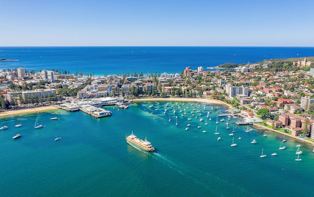Sydney Harbour with ferry and boats during Captain Cook 1 Day Hop-On-Hop-Off Cruise.