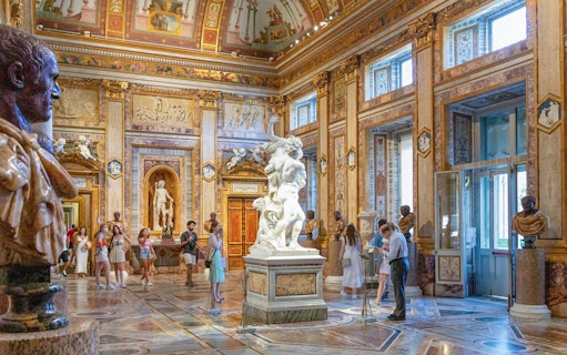 Tourists viewing sculptures at Borghese Gallery in Rome with skip-the-line tickets.