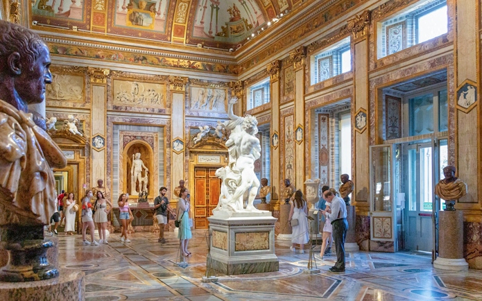 Tourists viewing sculptures at Borghese Gallery in Rome with skip-the-line tickets.