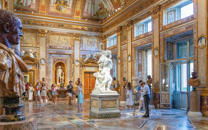 Tourists viewing sculptures at Borghese Gallery in Rome with skip-the-line tickets.