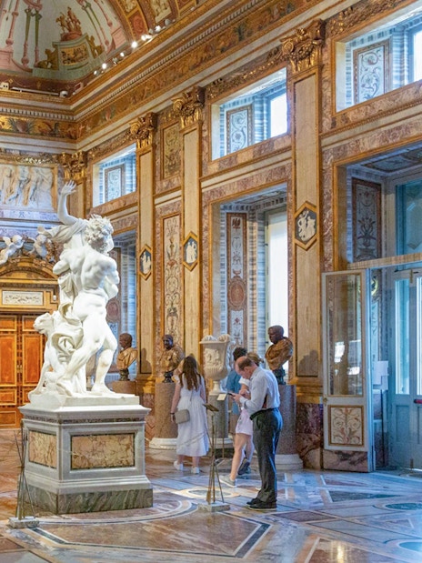 Tourists viewing sculptures at Borghese Gallery in Rome with skip-the-line tickets.