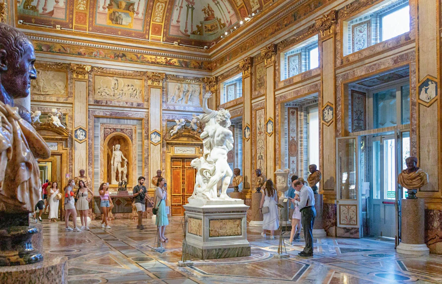 Tourists viewing sculptures at Borghese Gallery in Rome with skip-the-line tickets.