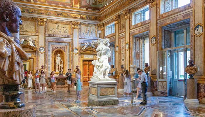 Tourists viewing sculptures and paintings at Borghese Gallery, Rome, with Skip-the-Line Tickets.
