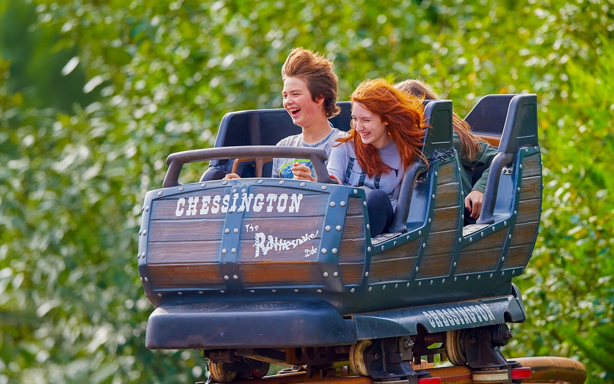 Riders enjoying the Rattlesnake roller coaster at Chessington World of Adventures.