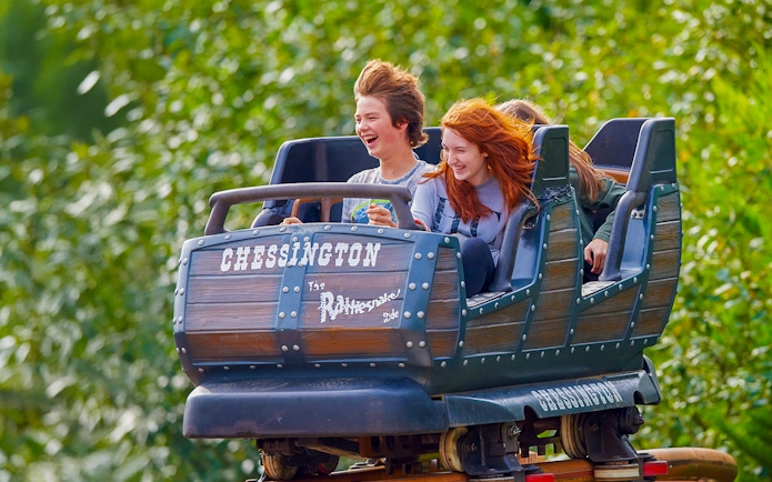 Riders enjoying the Rattlesnake roller coaster at Chessington World of Adventures.