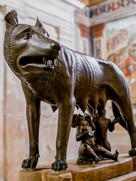 Capitoline She-Wolf statue with Romulus and Remus in Rome museum.