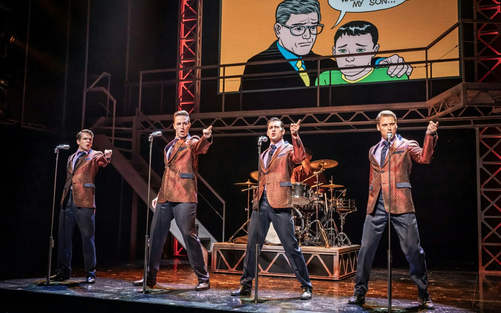 Performers on stage during a Jersey Boys musical scene.