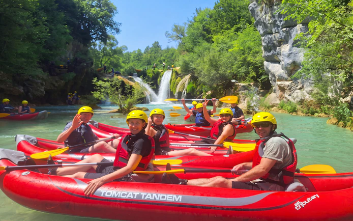 Tourists kayaking in Mrežnica Canyon with waterfalls in Split.
