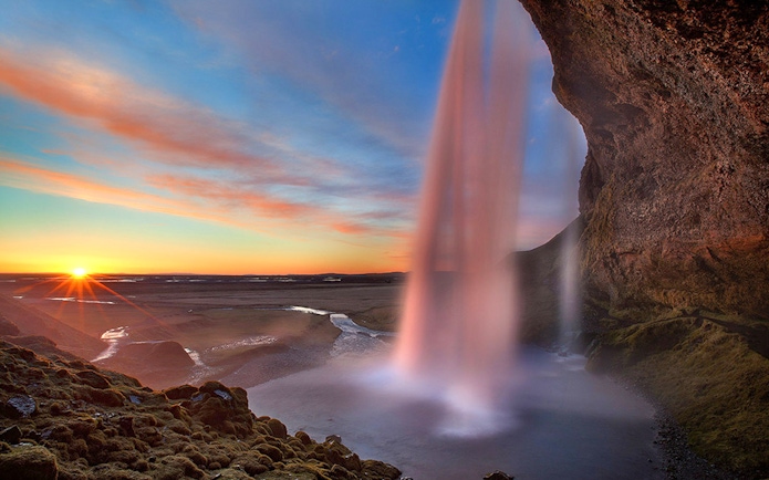 Seljalandsfoss waterfall at sunset during South Coast tour from Reykjavik.