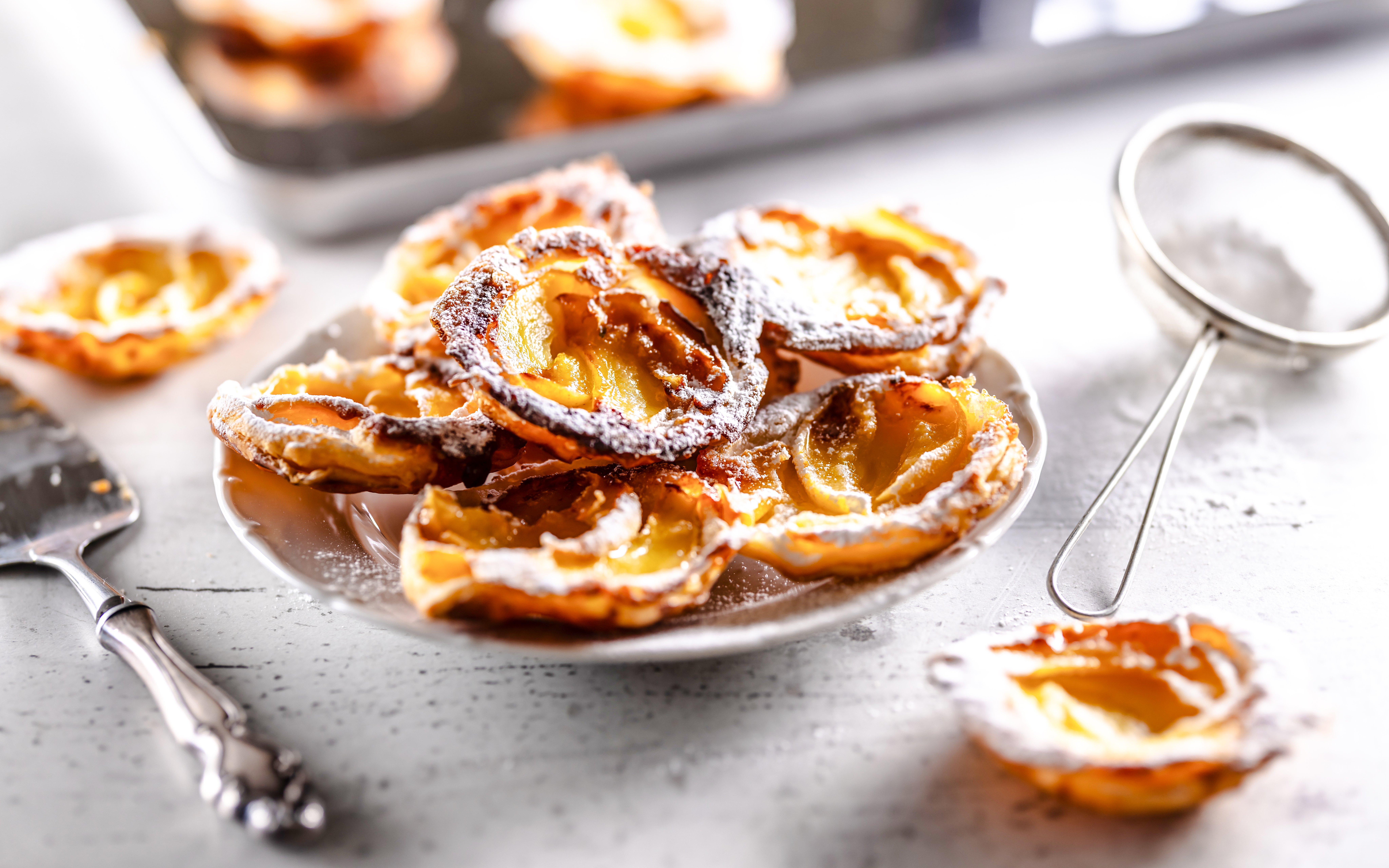 French pastries dusted with powdered sugar on a plate, Mont Saint Michel tour.