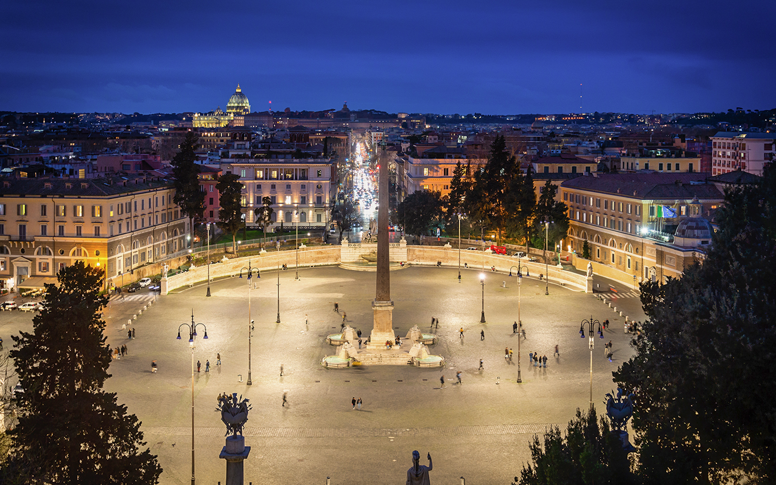 Piazza del Popolo illuminated at night with the obelisk in Rome, Italy.