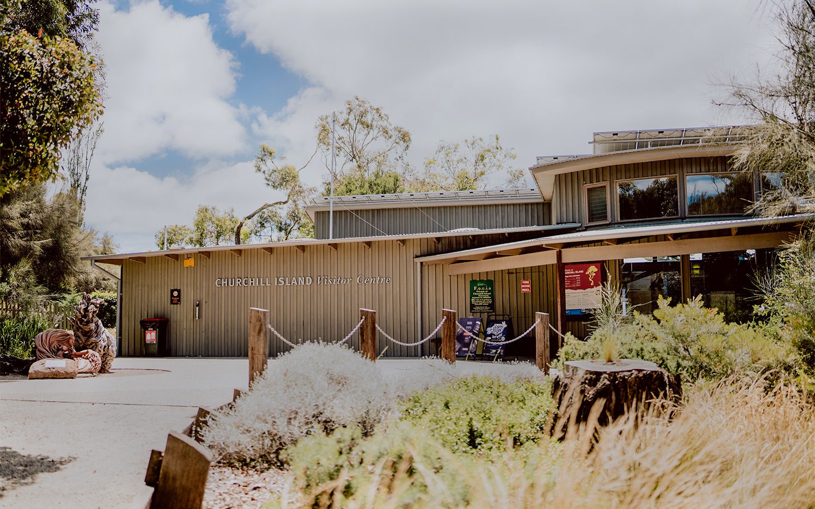 Churchill Island Visitor Centre entrance surrounded by greenery.