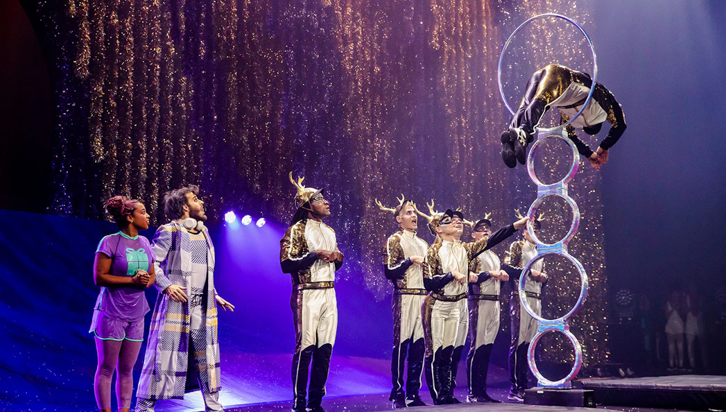 Acrobats performing a hoop jump in Cirque du Soleil's 'Twas The Night Before stage show.