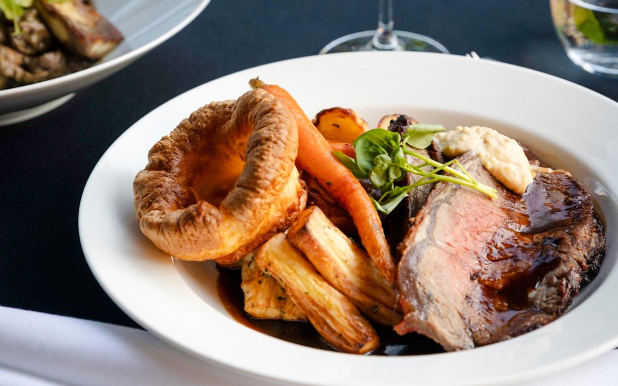 Roast beef with Yorkshire pudding and vegetables at National Gallery of Victoria restaurant.