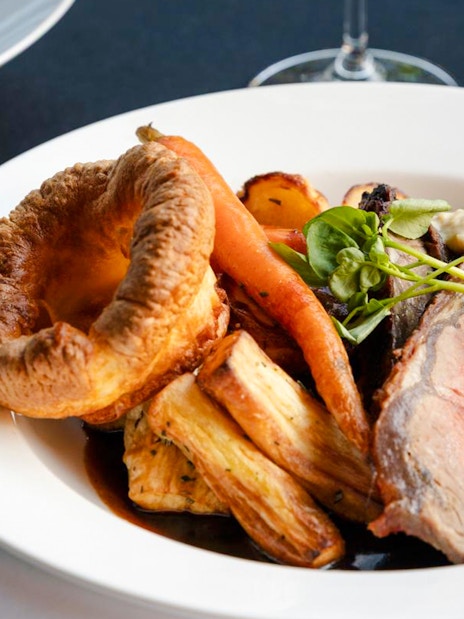 Roast beef with Yorkshire pudding and vegetables at National Gallery of Victoria restaurant.